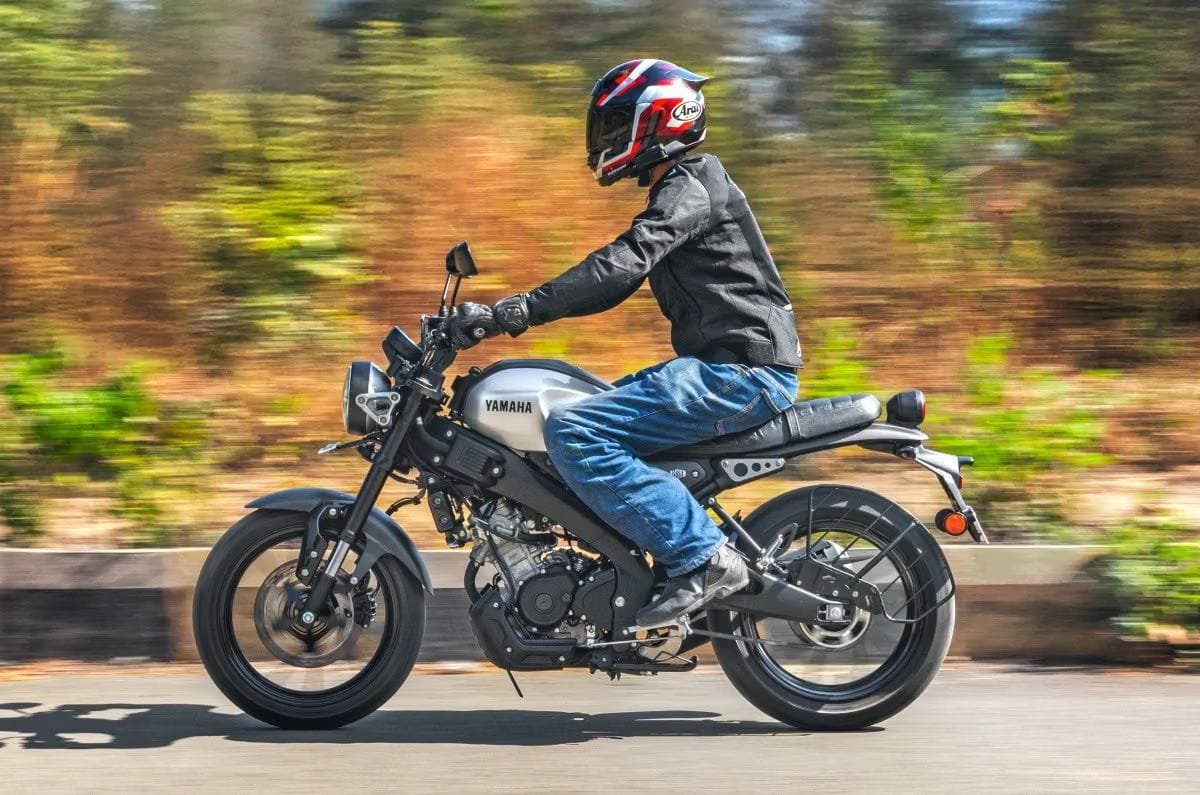 Yamaha XSR155 left side profile riding shot on road