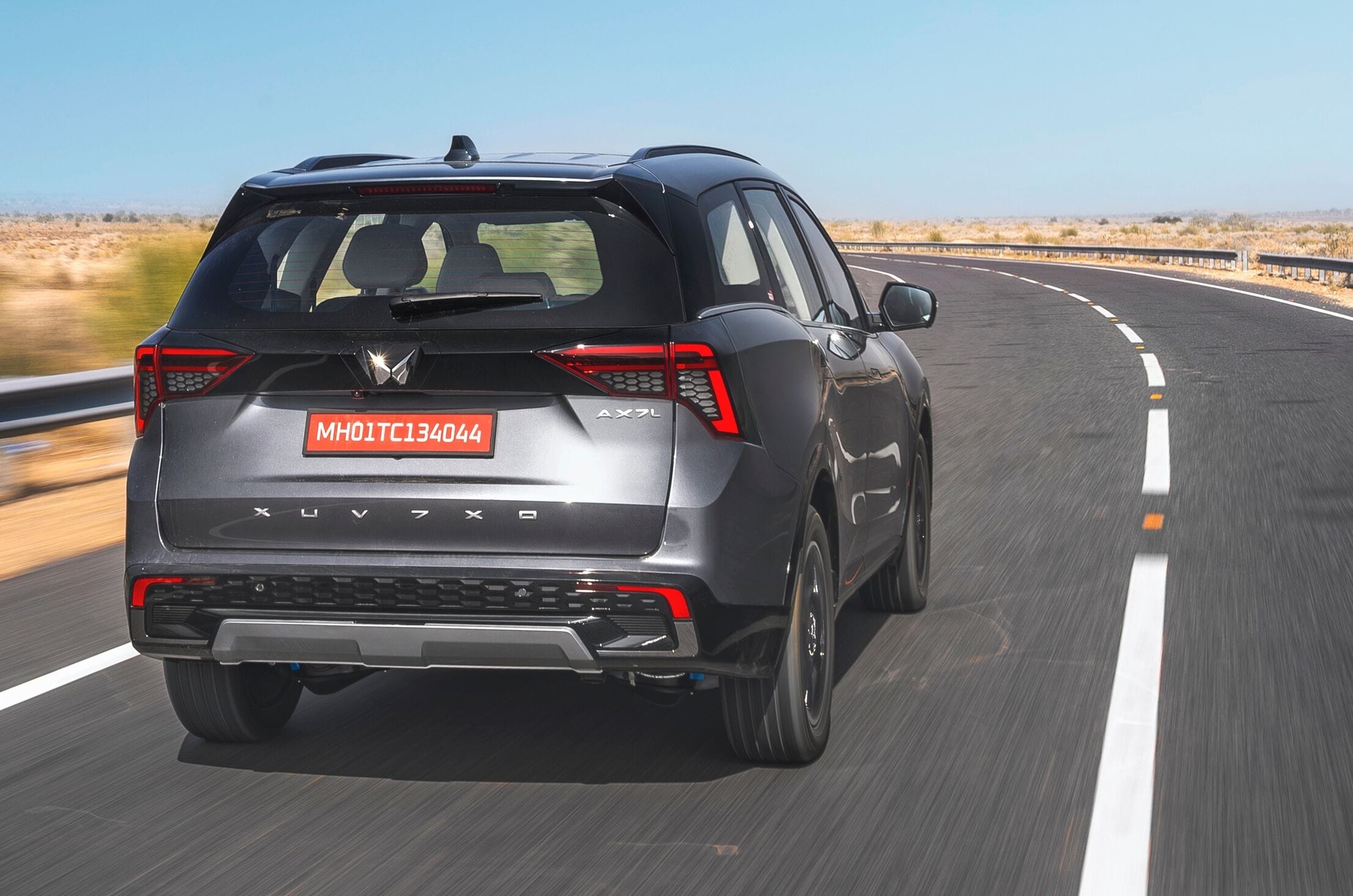 Mahindra XUV 7XO rear right side driving on road