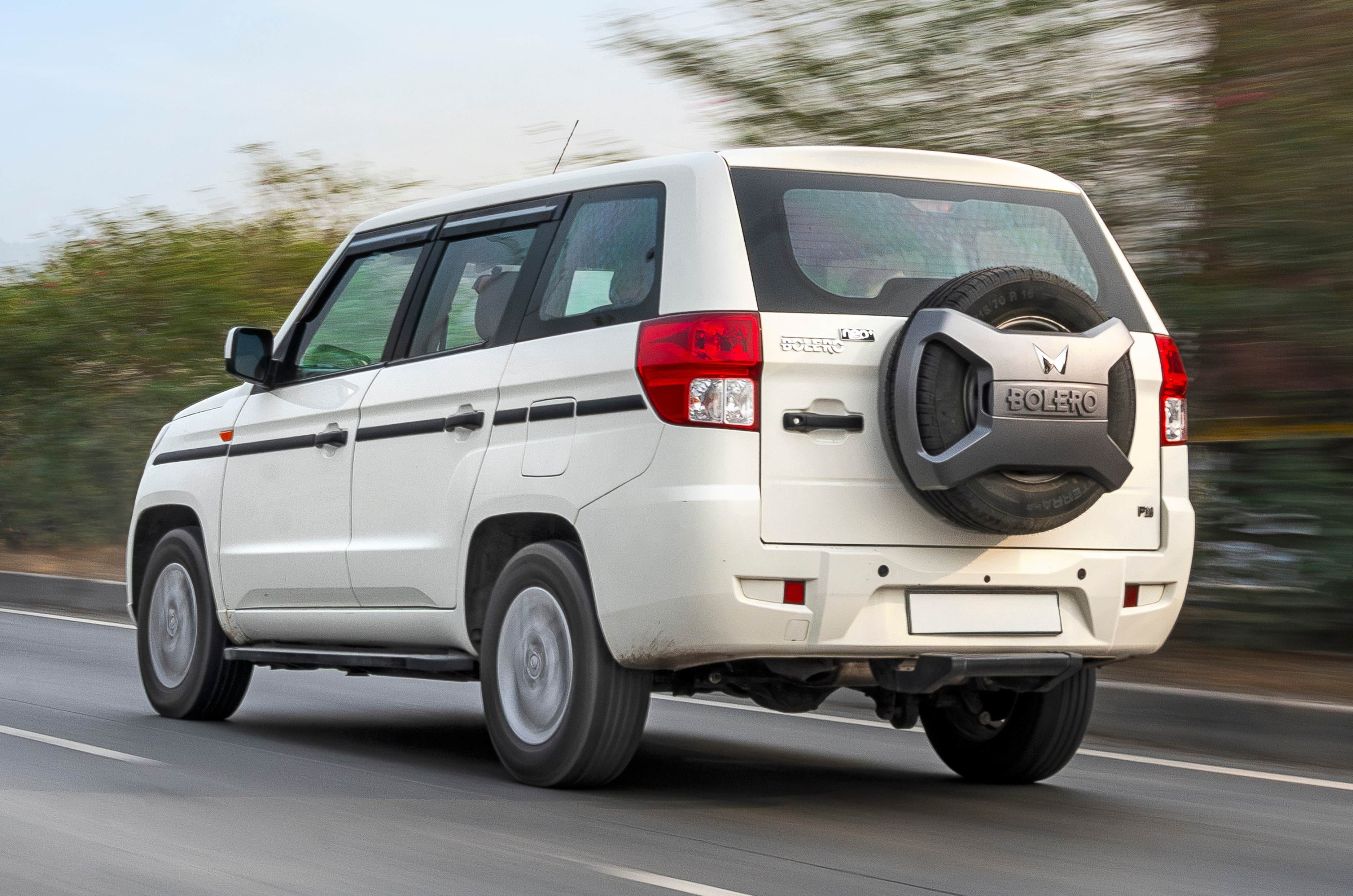 Mahindra Bolero Neo Plus review rear left side driving on road