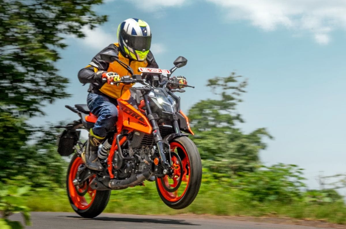 KTM 390 Duke front right side angle wheelie shot on road