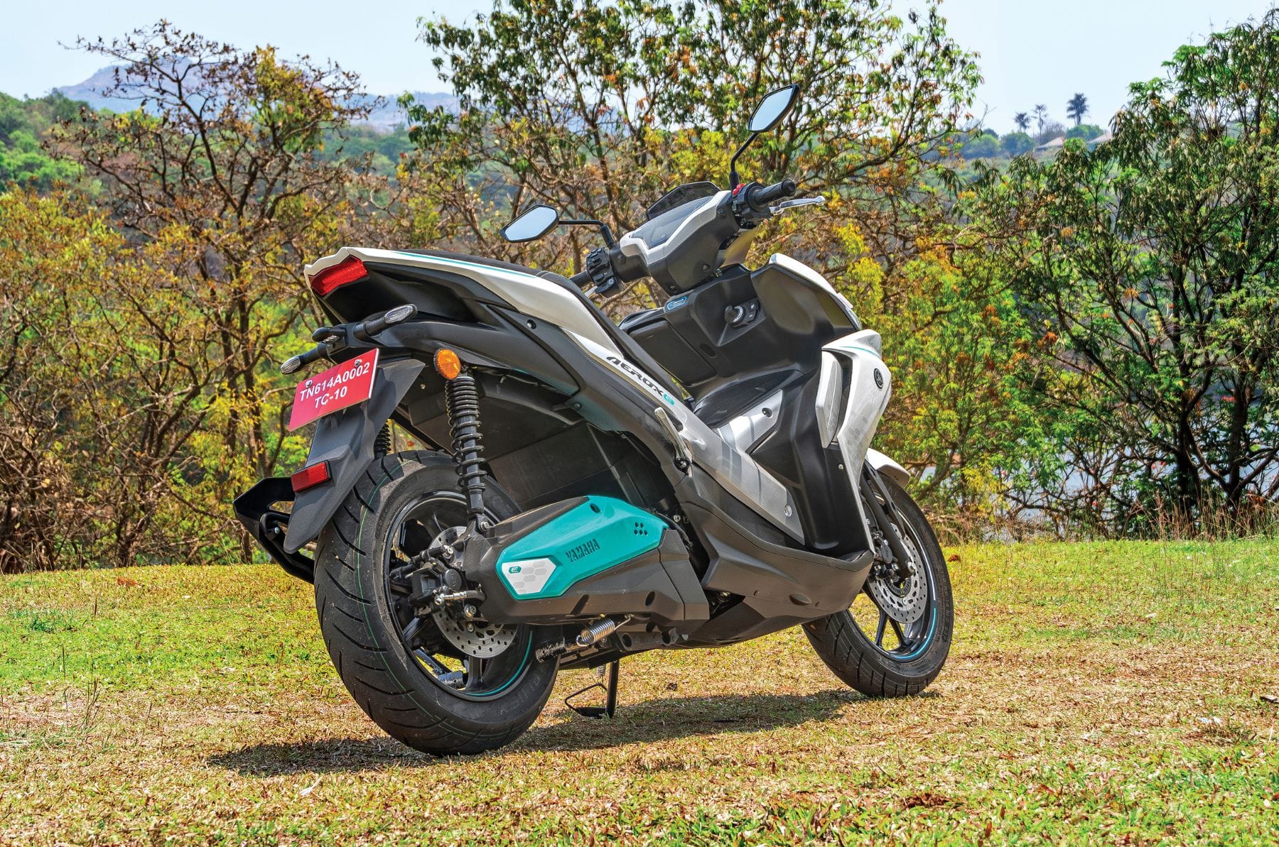 Yamaha Aerox E right rear angle static in field