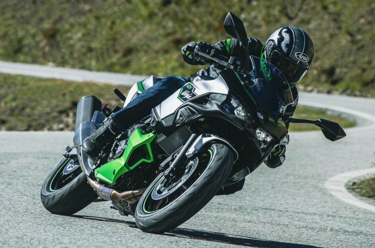 Kawasaki Ninja 7 hybrid front right side riding shot on highway