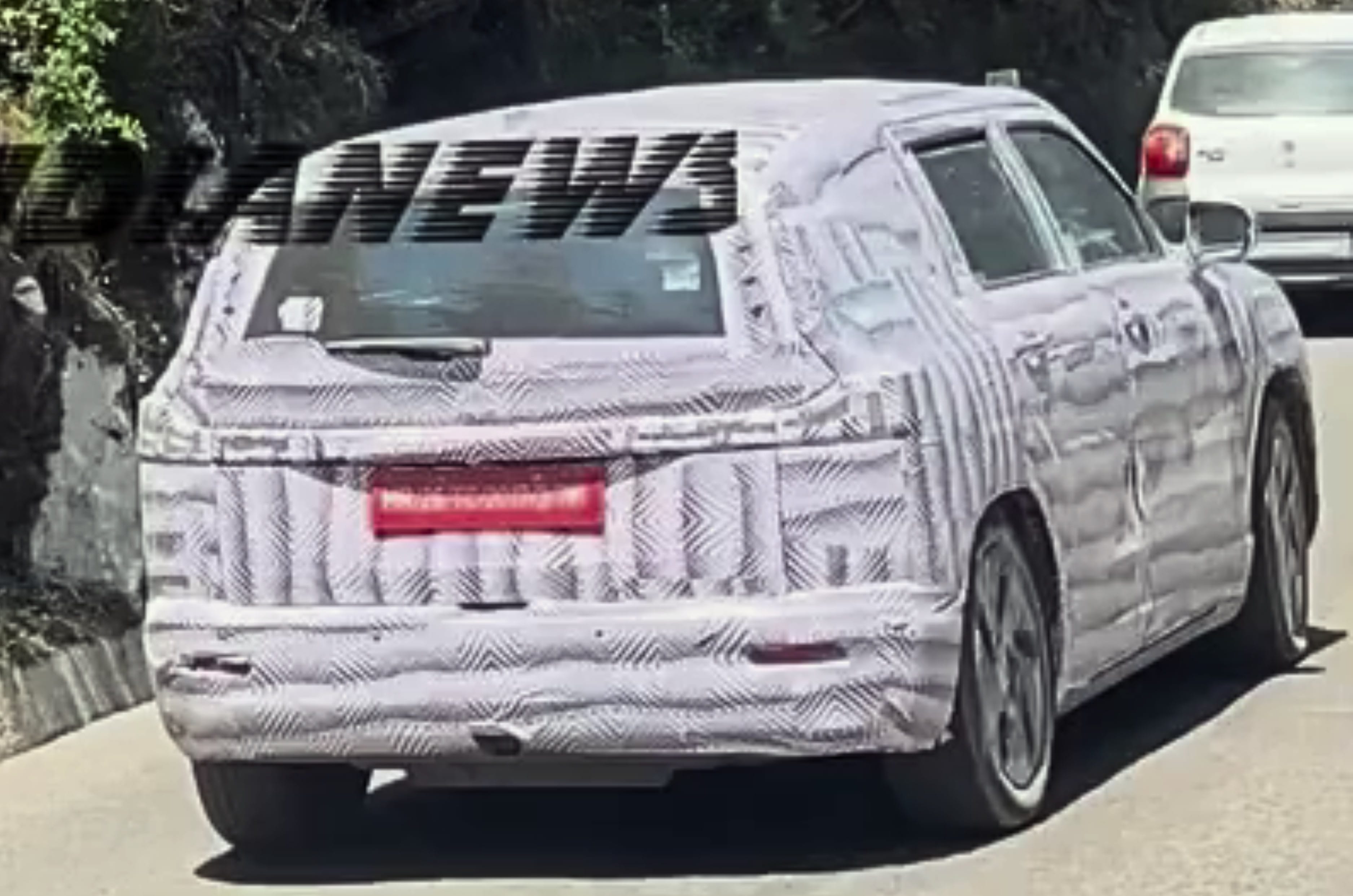 New Maruti three-row EV spied testing