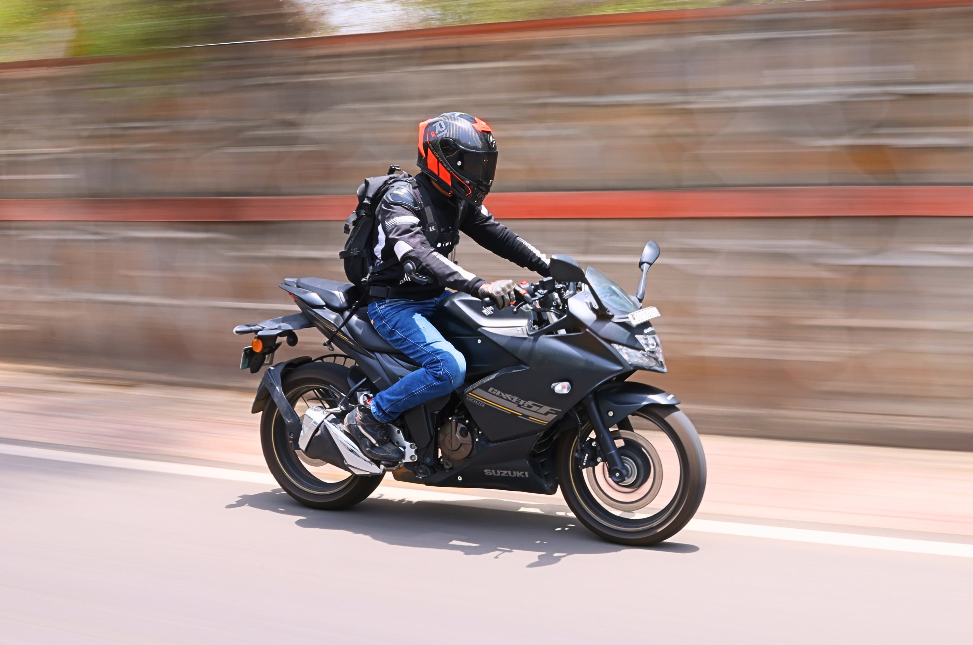 Suzuki Gixxer SF 250 flex fuel front right side riding shot on road