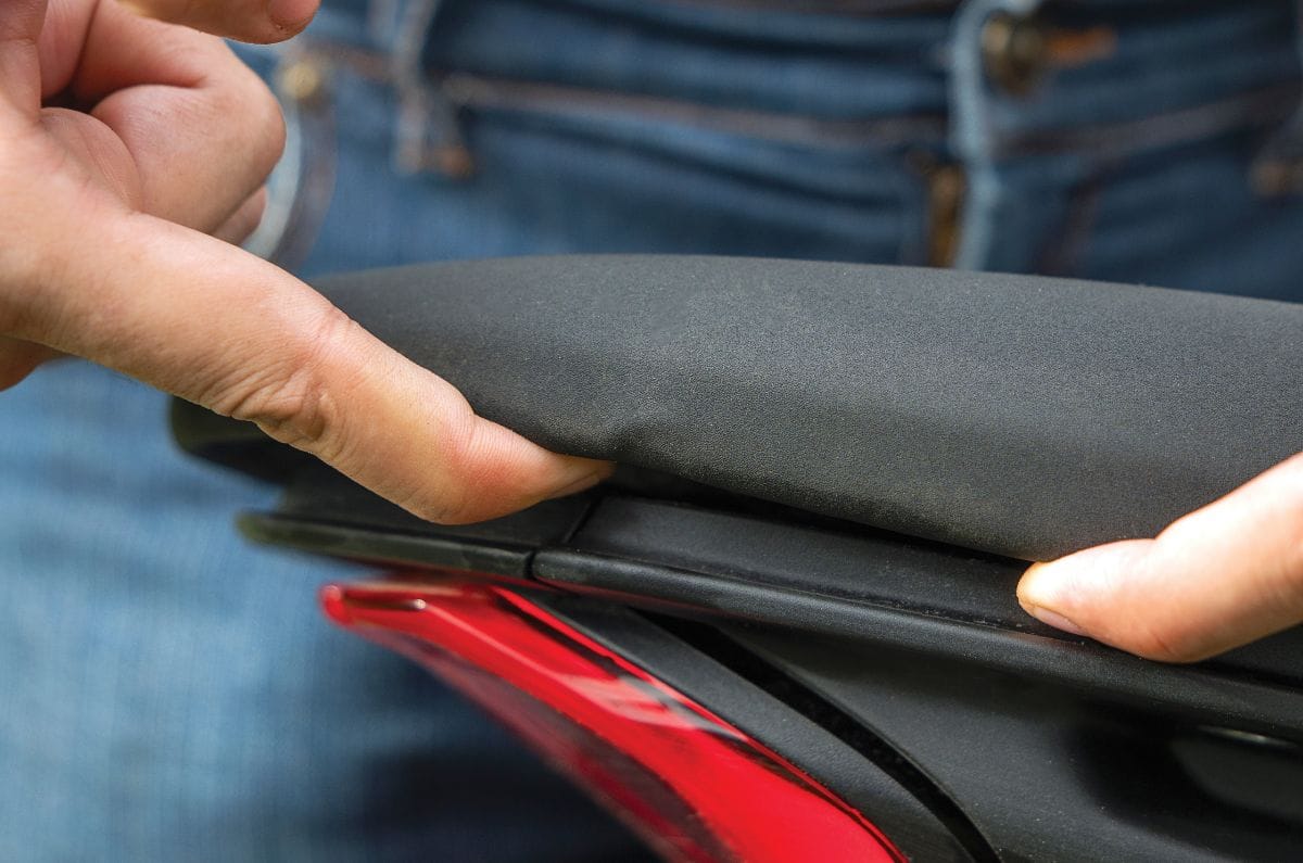 A close up, outside shot showing the gap between the Ducati Monster V2's pillion seat and the subframe