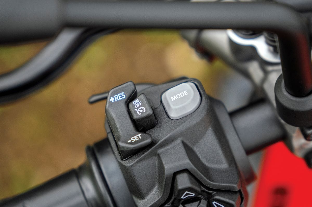 A close up shot showing the cruise control buttons on the Ducati Monster V2's left side