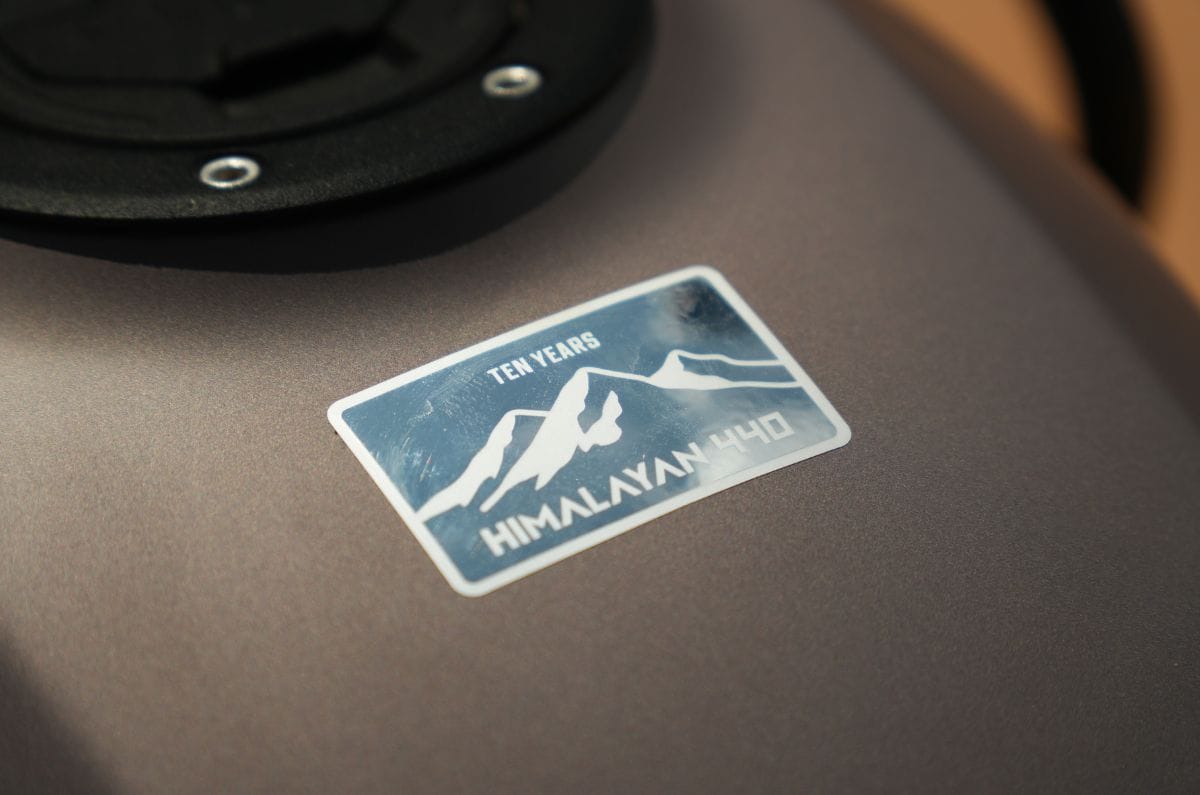 Close up of the Royal Enfield Himalayan 440's commemorative "Ten Years" tank badge