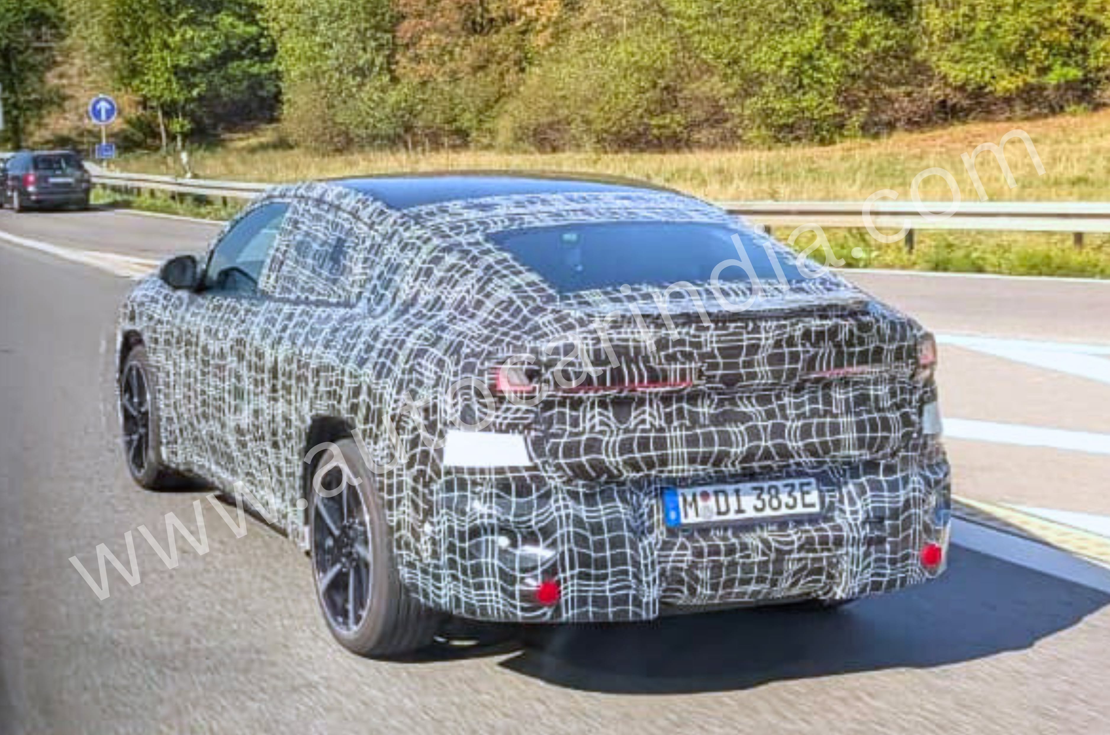 BMW iX4 electric coupe SUV spotted testing