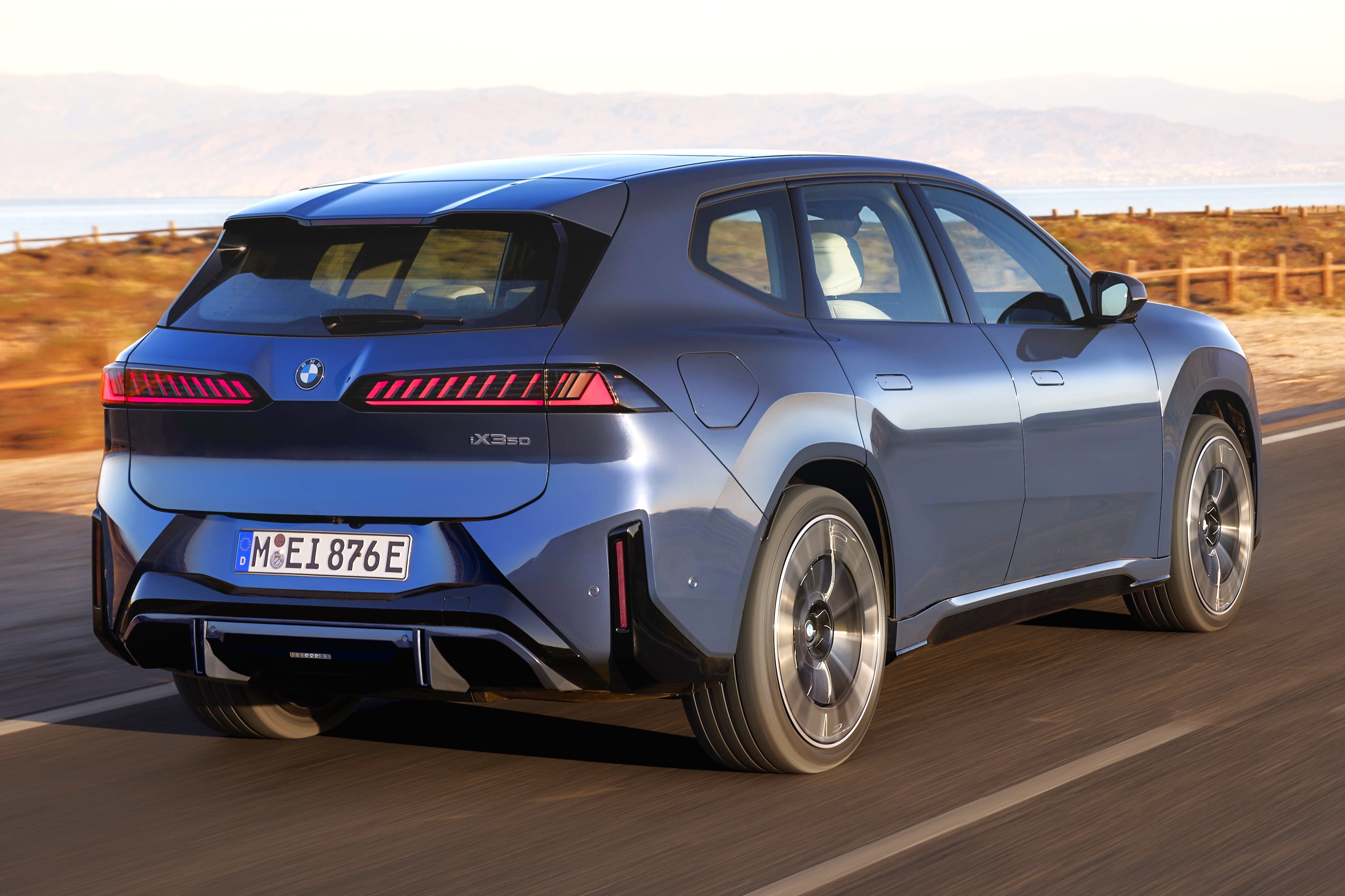 BMW iX4 electric coupe SUV spotted testing