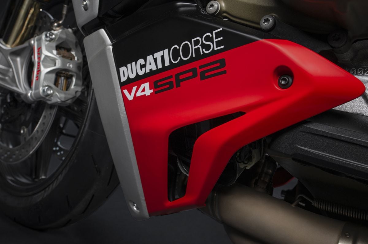Close up indoor shot of the 2023 Ducati Streetfighter V4 SP2's lower side panel showing the name