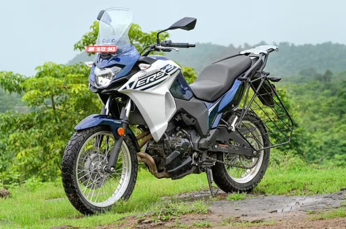 Static of versys x-4300 parked against lush green landscapes