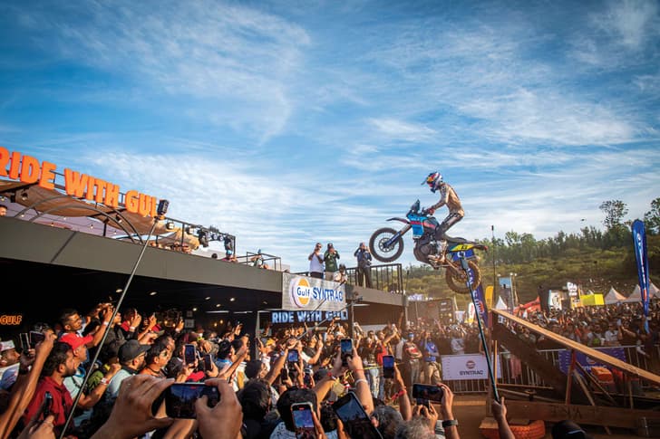 Pol Tarres jumps off the stage with a sea of people looking on