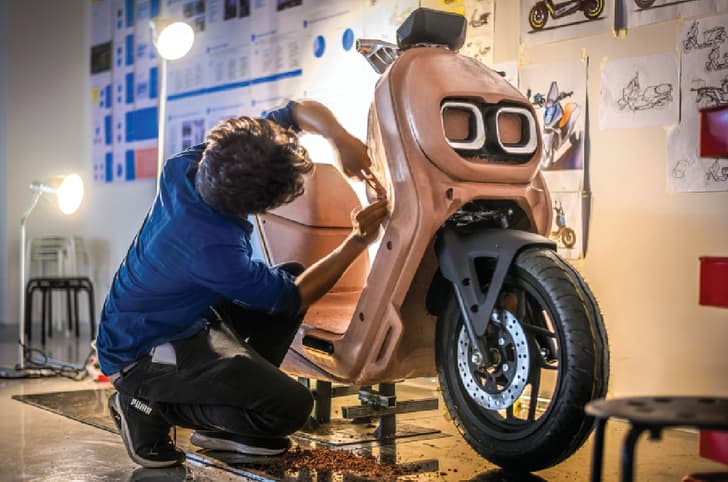 Designer working on a clay mould of the River Indie