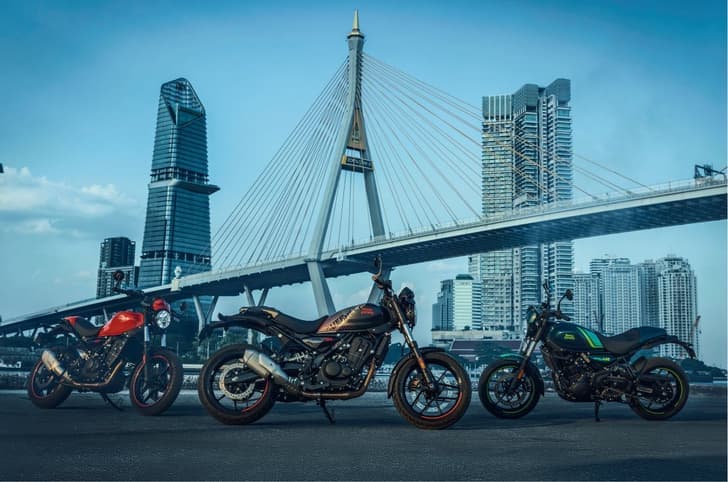 Three Royal Enfield Guerrilla 450 Apex bikes parked side by side