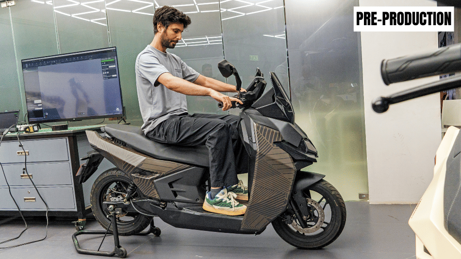 Rishaad Mody sitting on UV Tesseract pre production scooter