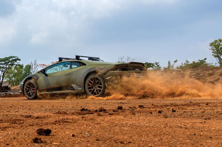 Lamborghini Huracan Sterrato rear quarter tracking Lamborghini Huracan Sterrato rear quarter tracking