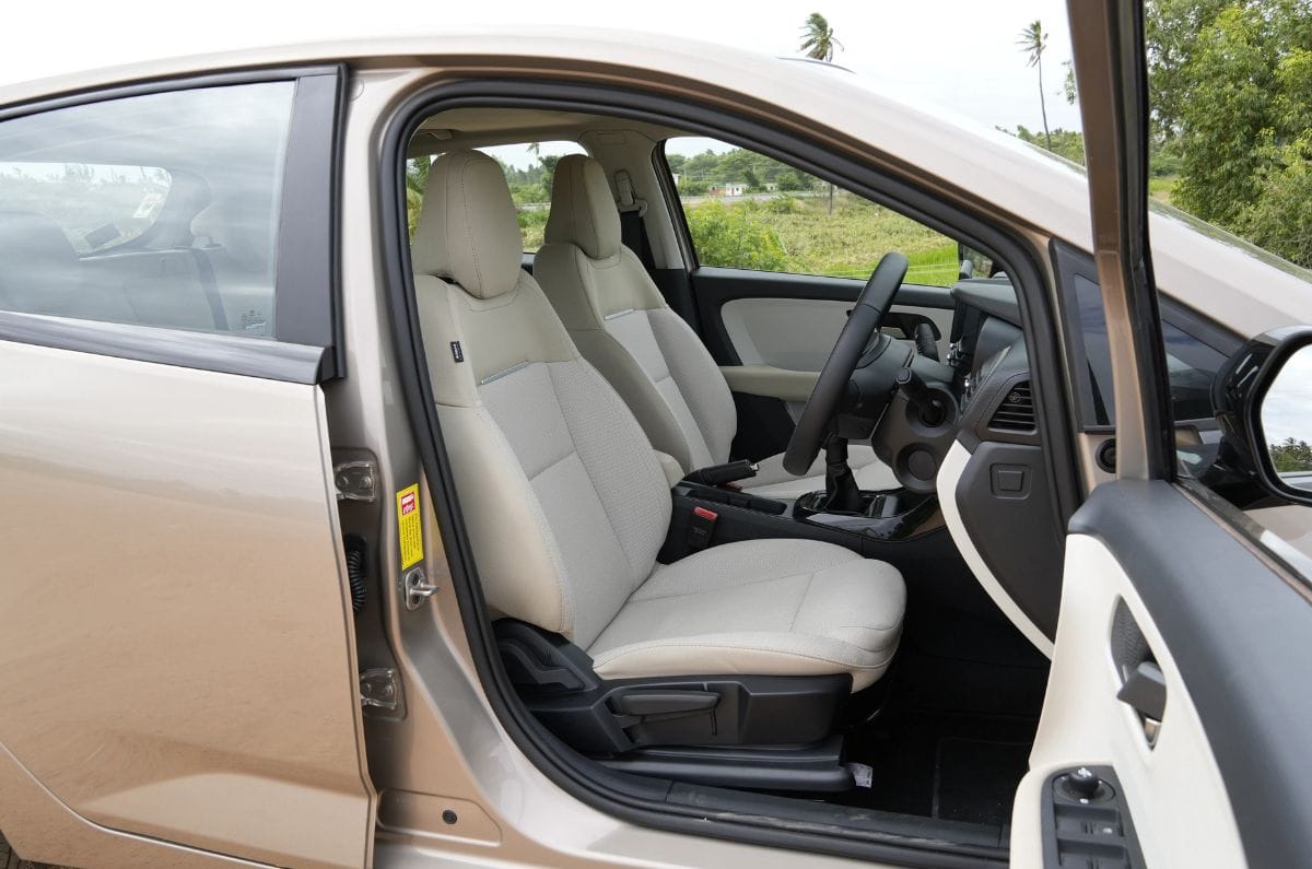 The hatchback comes with fabric upholstery and the driver's seat gets manual height adjustment only.