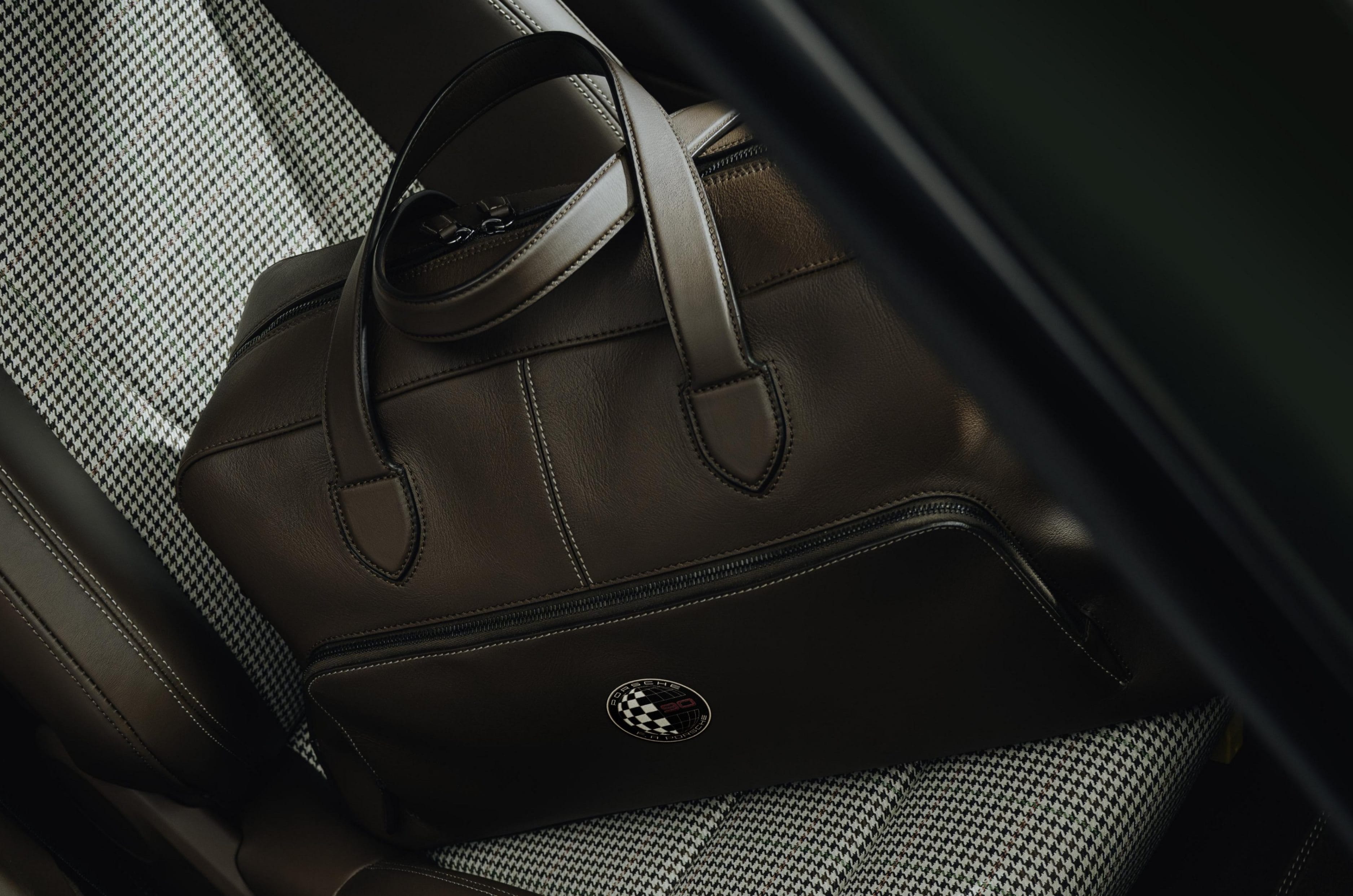 It also comes with a Weekender bag with the same interior colour, stitching and materials, with an anniversary logo.