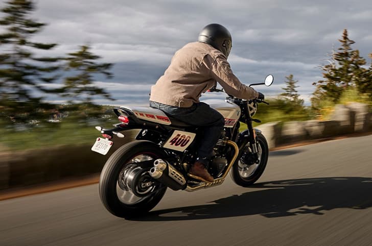 Triumph Tracker 400 rear three quarter riding shot