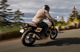 Triumph Tracker 400 rear three quarter riding shot