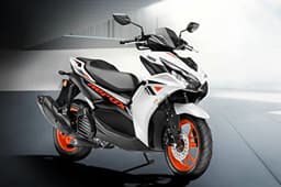 Yamaha Aerox ice fluo vermillion front right side static in parking lot