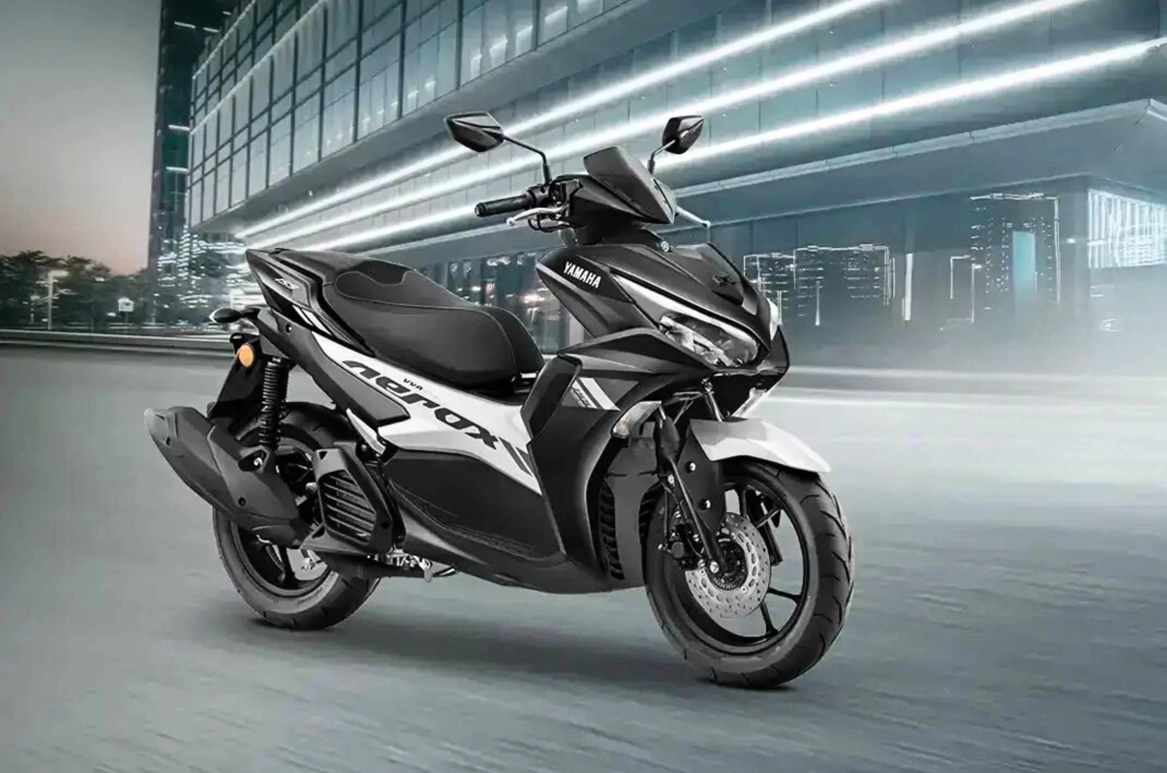 Yamaha Aerox black front right side static in parking lot