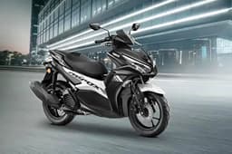 Yamaha Aerox black front right side static in parking lot