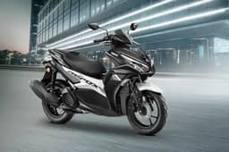 Yamaha Aerox black front right side static in parking lot