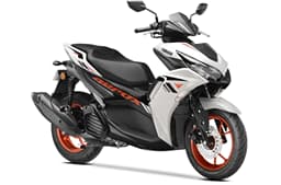 Yamaha Aerox ice fluo vermillion front right side static in studio