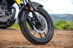 Close up image of the front wheel and tyre of the Suzuki V-Strom SX