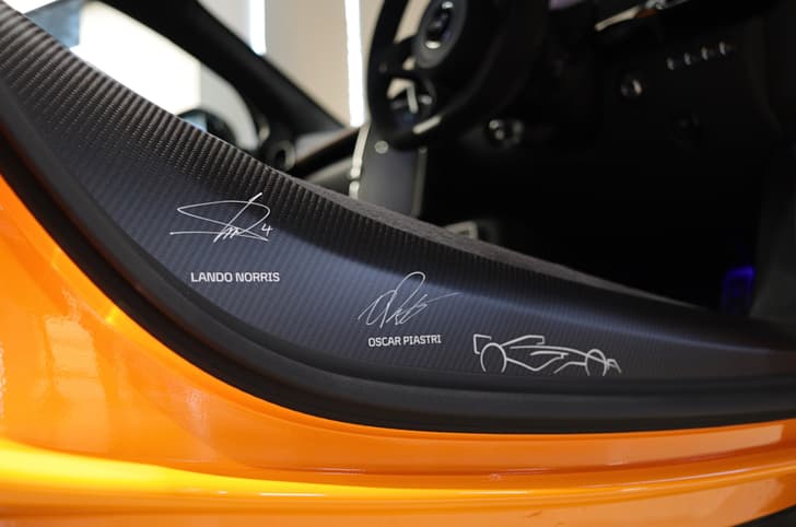 McLaren MCL38 Celebration Edition Artura door sill autographs