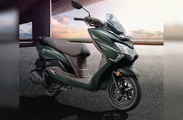 Suzuki Burgman Street green colour front right static in parking garage