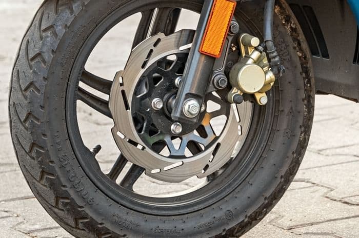 Close up image of the front wheel and disc brake