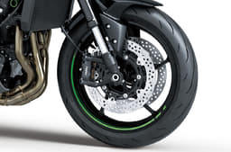Close up of Kawasaki Z900 front wheel and brake caliper