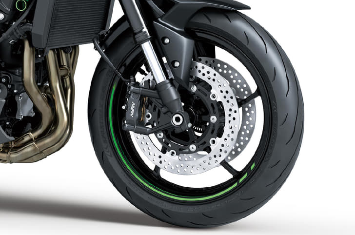 Close up of Kawasaki Z900 front wheel and brake caliper