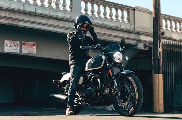 Royal Enfield Shotgun 650 white right front static image under a bridge