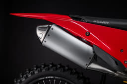 Close-up of the high-mounted exhaust system tucked beneath the rear bodywork.