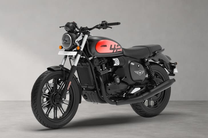 Front left quarter of the Jawa 42 FJ in All Stars Matte Black (Red Clad) colour.