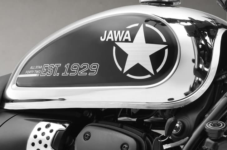 Close up shot of the fuel tank with an All Star sticker and insignia on the Jawa 42 FJ All Stars Edition