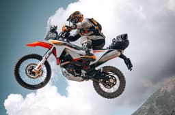 A rider performing a jump on the KTM 690 Rally