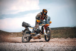A rider performing a drift on the KTM 690 Rally