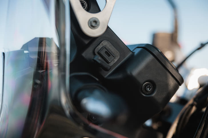 A close up shot of the USB Type-C port on the KTM 690 Rally.