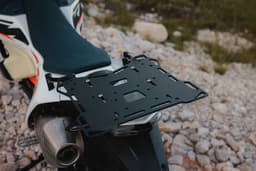 A close up shot of the KTM 690 Rally's rear luggage rack.