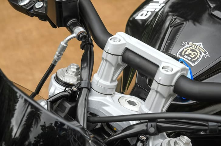 A close up image of the Aprilia Tuono 457 Special Edition's new, 10mm taller handlebar risers.