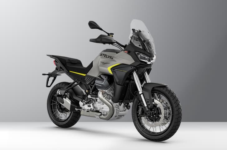 Inside render showing the Moto Guzzi Stelvio's front right three quarter in Grigio Climbing colour.