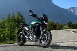 Outside image showing the Moto Guzzi Stelvio's front right three quarter in Verde Hiking colour.