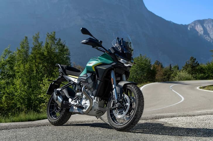 Outside image showing the Moto Guzzi Stelvio's front right three quarter in Verde Hiking colour.