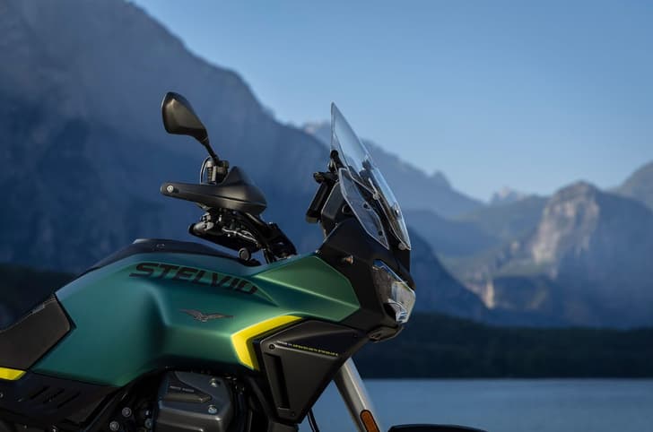 A right, close up shot of the Moto Guzzi Stelvio's 21-litre tank and handguards that are standard accessories.