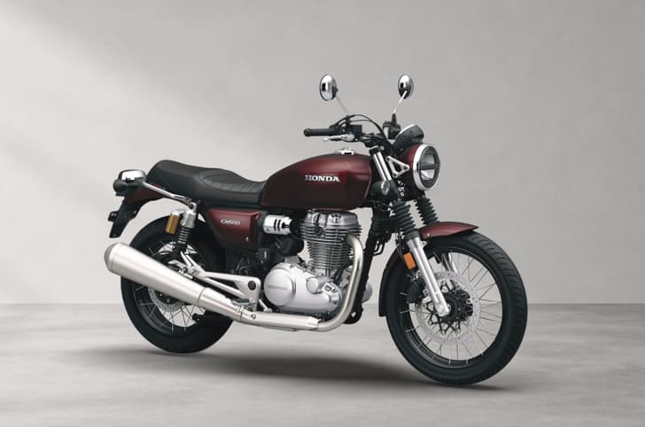 Inside render showing the Honda CB500 in Rebel Red Metallic colour.