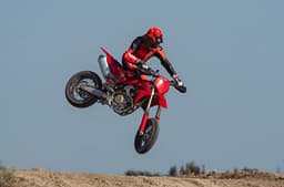 Outside image showing showing a whip being performed on the Ducati Desmo450 SM.
